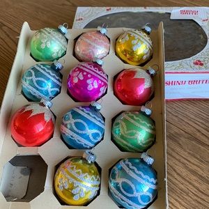 Vintage Shiny Brite ornaments. Comes with complete box. Has glitter dust designs